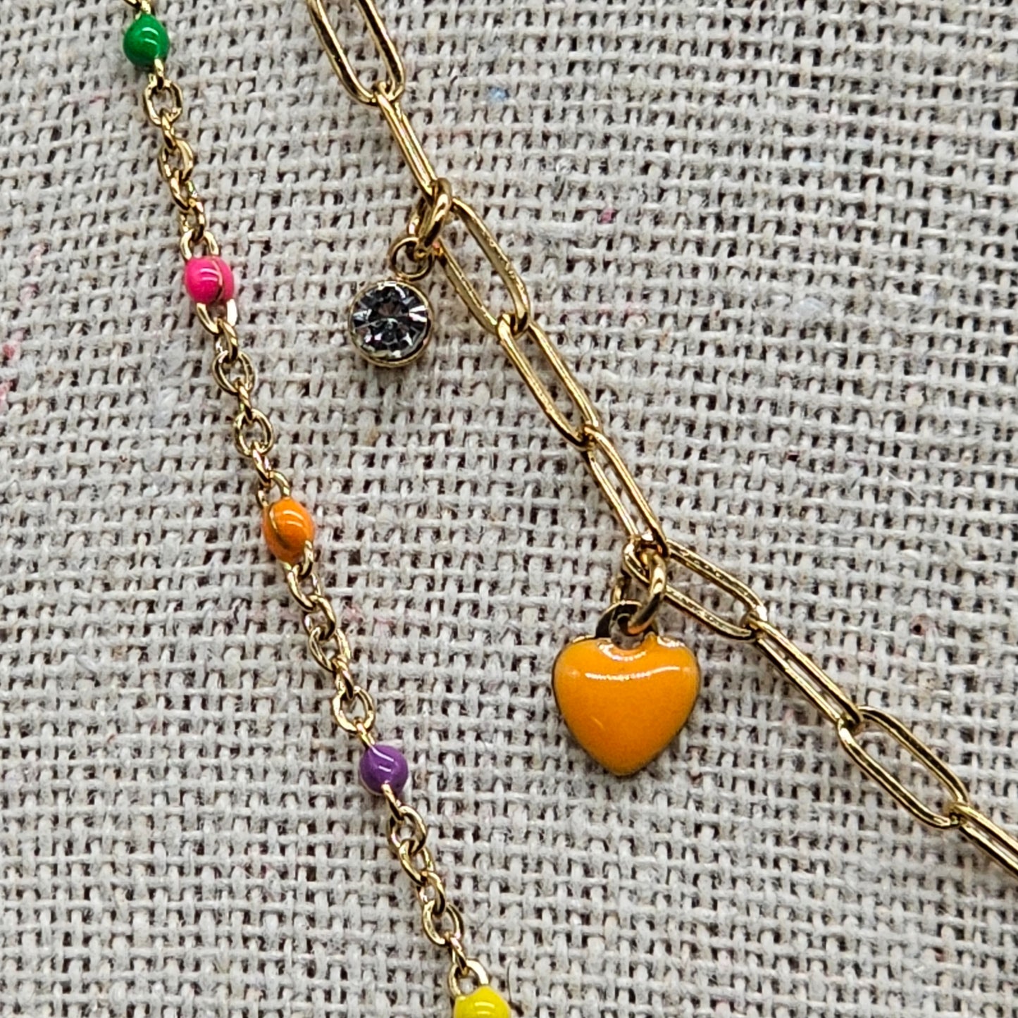 Collier "good vibes" double chaîne acier inoxydable doré chaîne maille forcat perle en pierre reconstituée pampille coeur et perle et strass