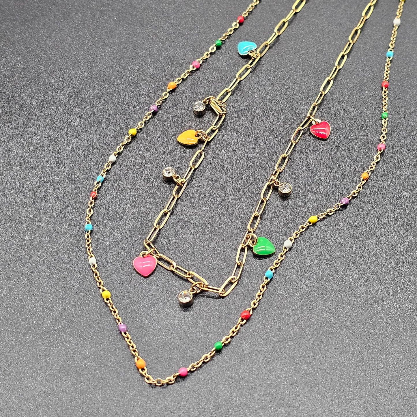 Collier "good vibes" double chaîne acier inoxydable doré chaîne maille forcat perle en pierre reconstituée pampille coeur et perle et strass