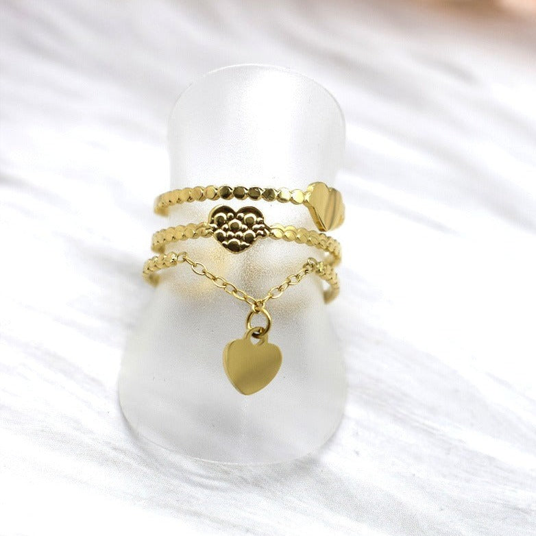 Bague triple rang ouverte ajustable trois anneaux acier inoxydable perlé doré argenté coeurs lisses martelés chaînette pampille forme coeur