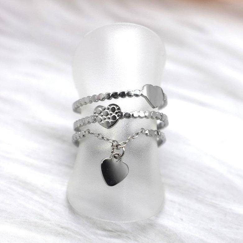 Bague triple rang ouverte ajustable trois anneaux acier inoxydable perlé doré argenté coeurs lisses martelés chaînette pampille forme coeur