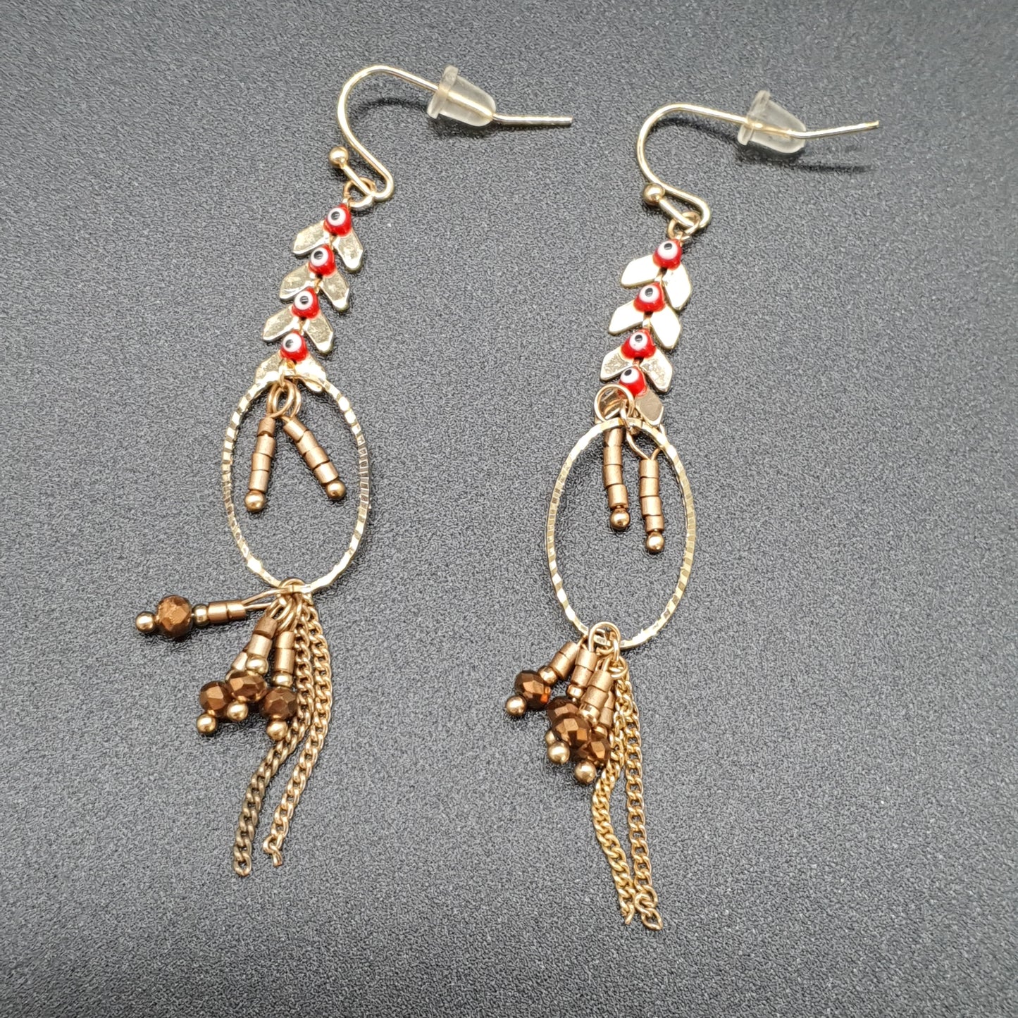 Boucles pendantes acier doré – anneau & cascade chevrons torsadés