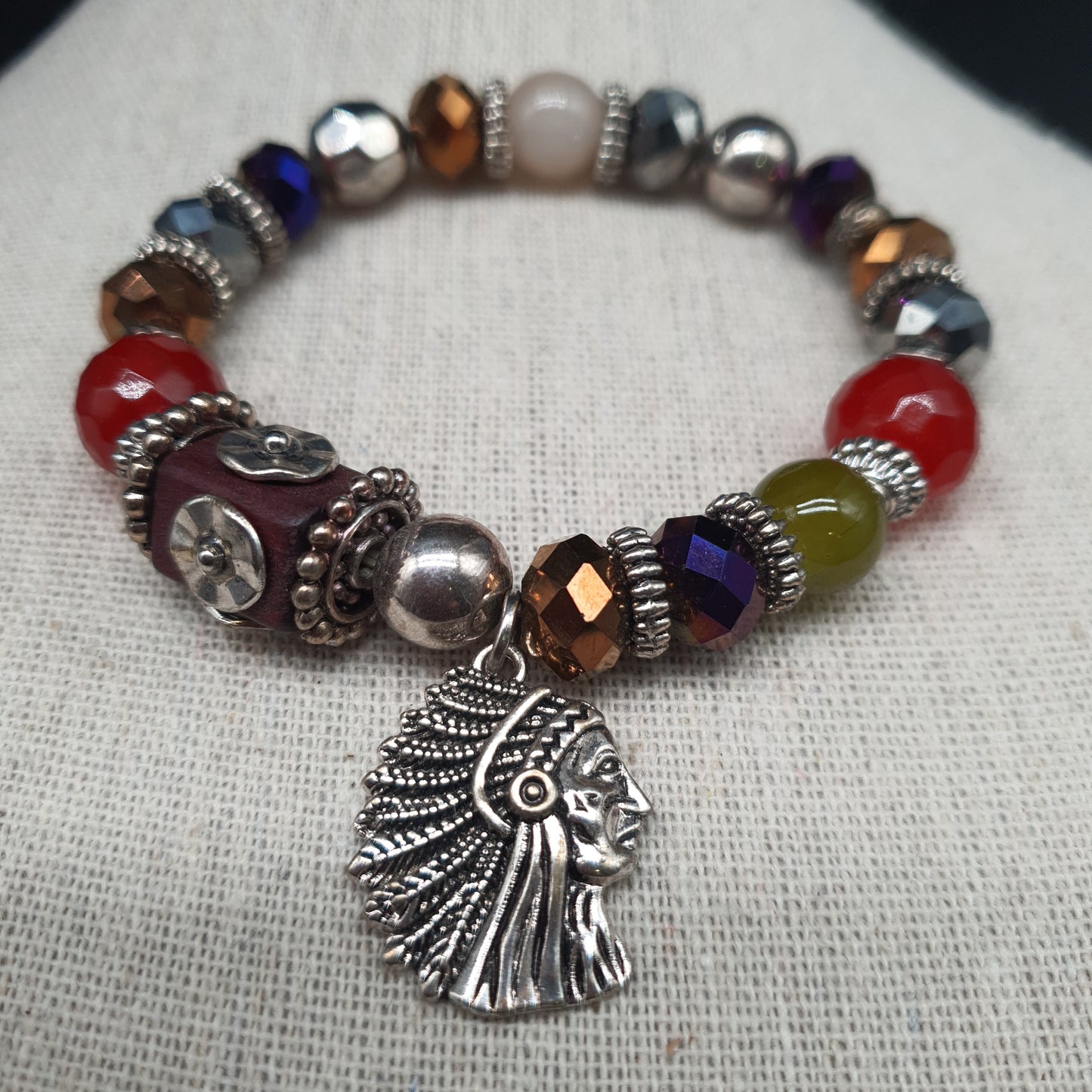 Bracelet élastique perles facettées et plumes métal argenté