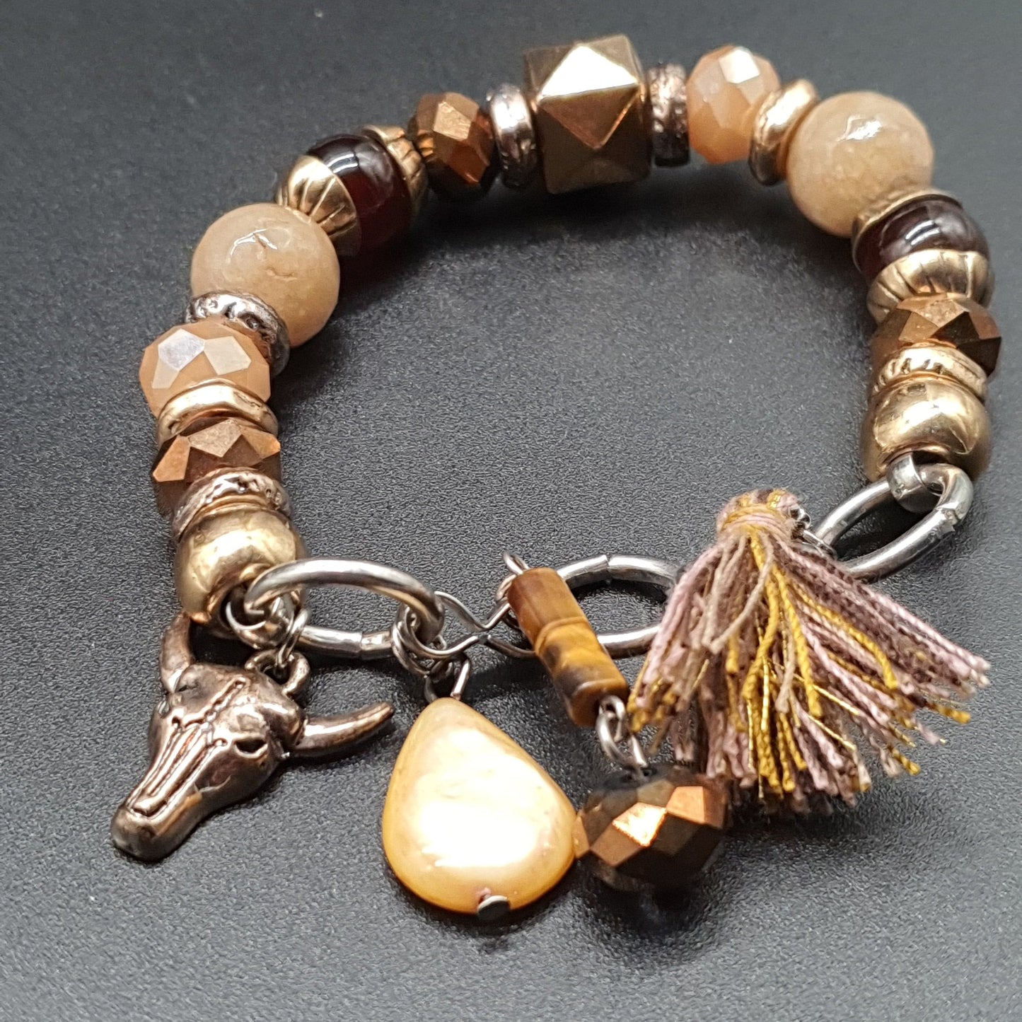 Bracelet élastique perles facettées doré pampille cœur et aile d’ange