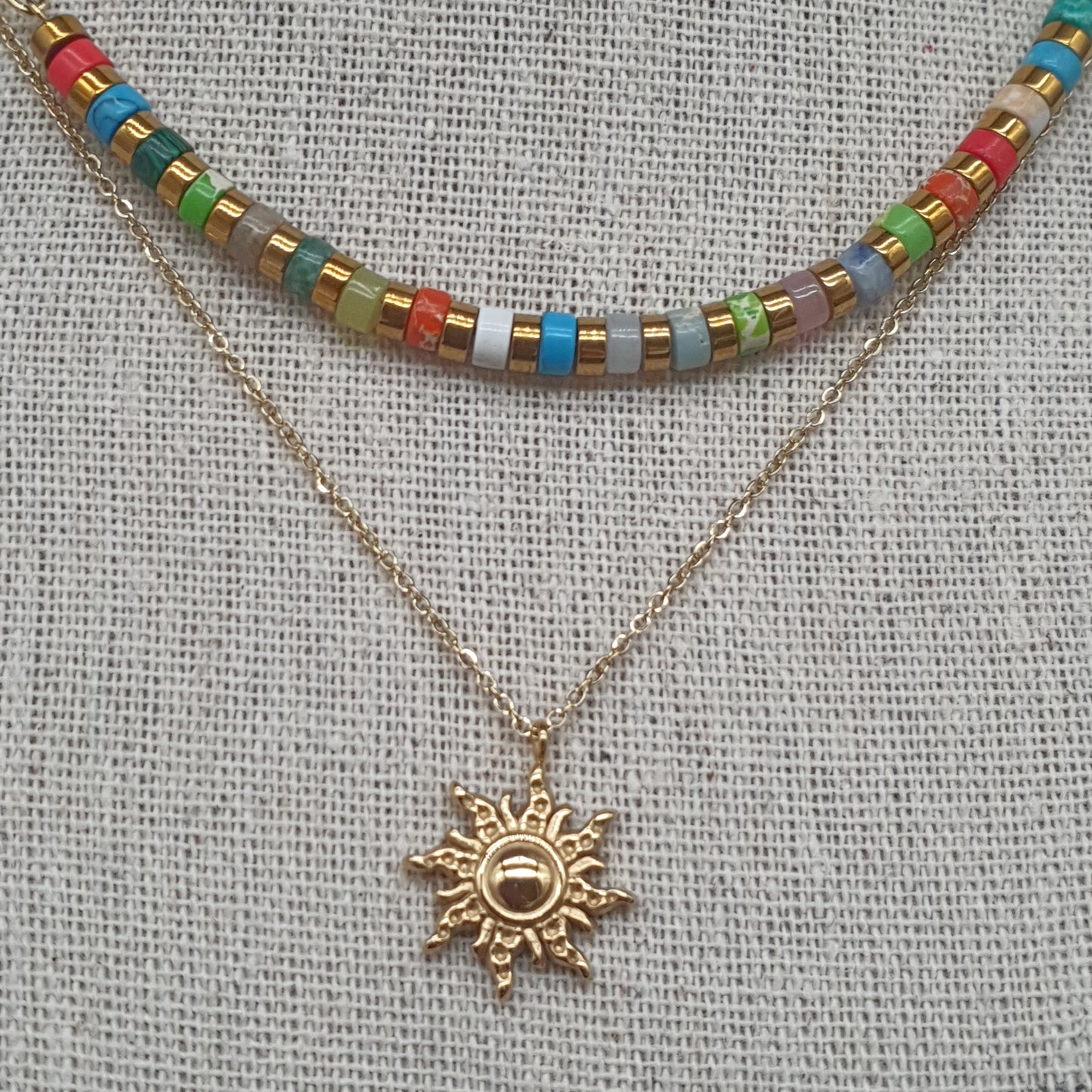Collier double chaîne acier inoxydable doré ou argenté pendentif soleil astral