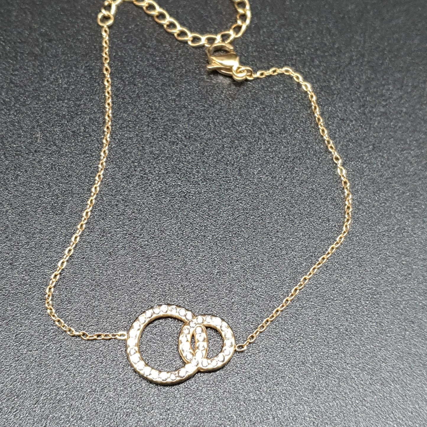 Bracelet doré fin deux anneaux entrelacés cristaux – Acier inoxydable