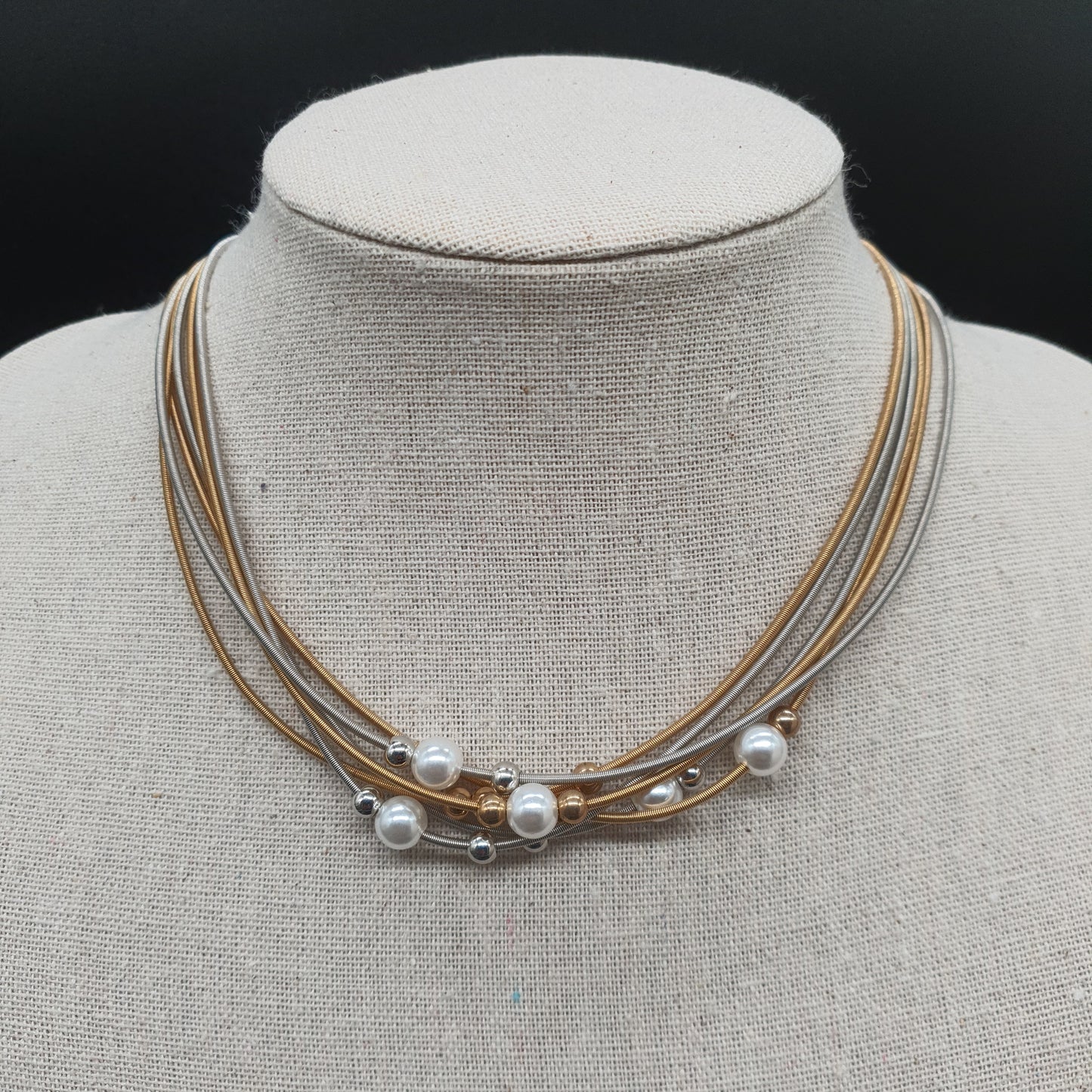 Multi-strand necklace with mother-of-pearl beads, silver- and gold-plated steel