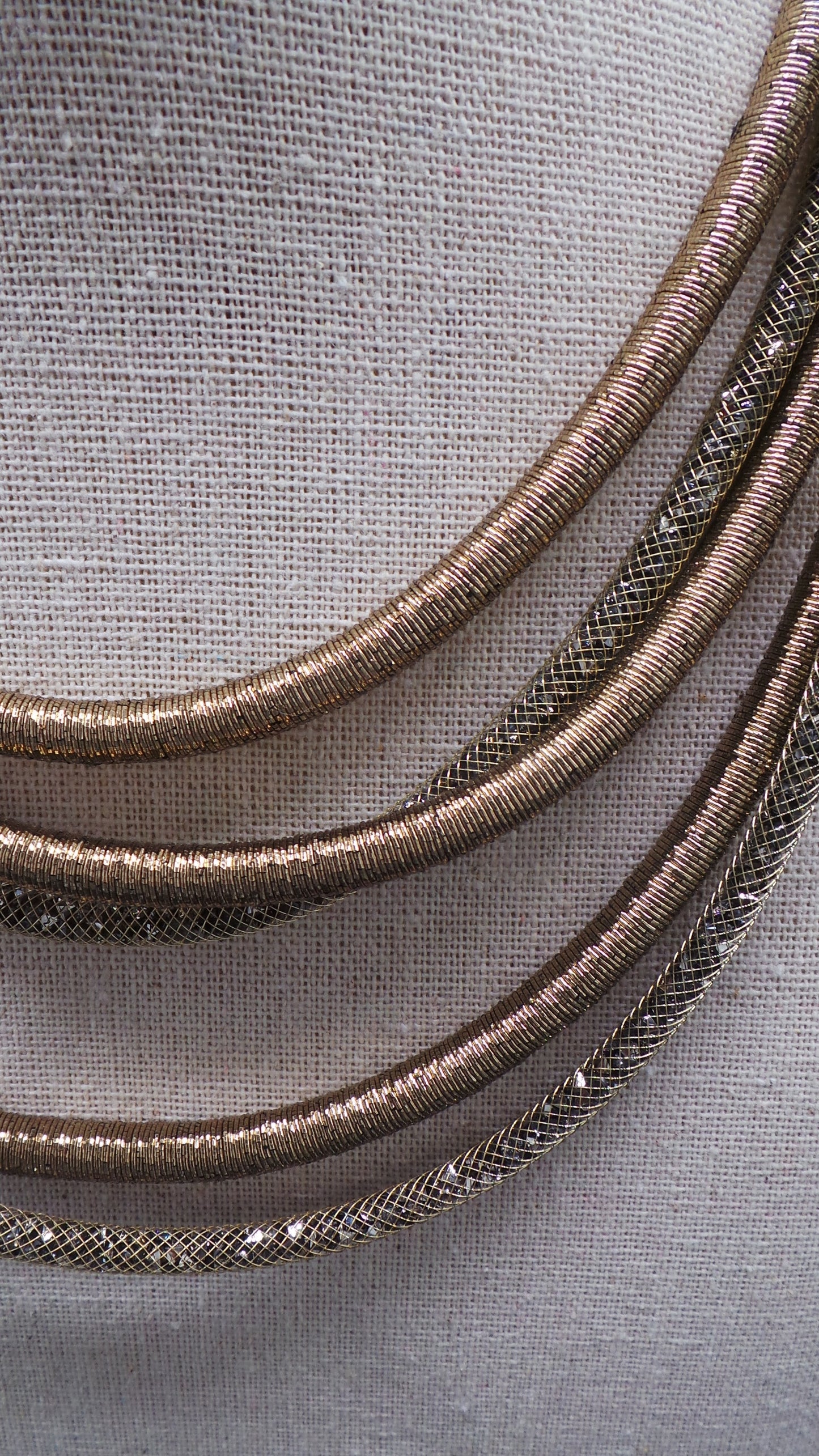 Beige multi-strand necklace with mesh tubes and crystal-effect metallic threads