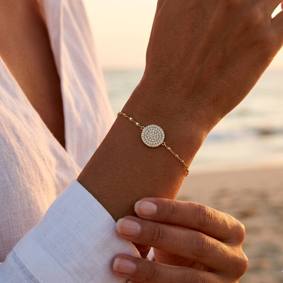 Gold-plated steel bracelet, thin twisted fancy mesh chain, gold-plated metal piece with rhinestones.