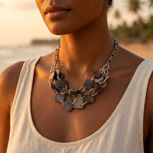 Triple-strand aged steel necklace with chunky links and geometric hammered lozenges