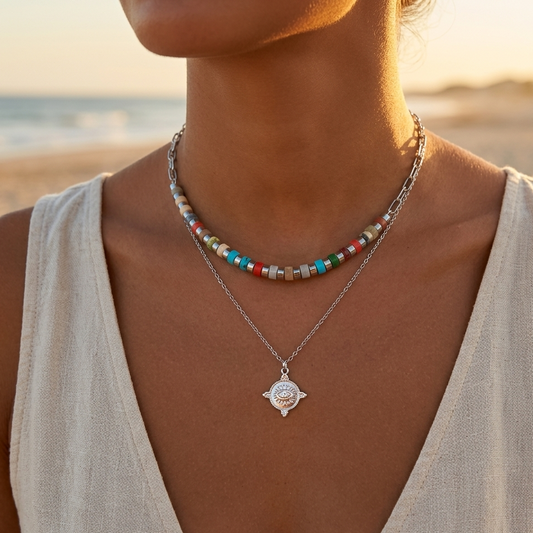 Double chain necklace with pearl accents in gold or silver stainless steel with a delicate mystic eye medallion