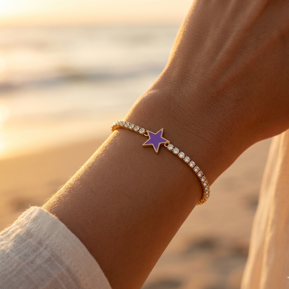 Gold stainless steel bracelet with mesh set with white rhinestones and purple enamel star pendant