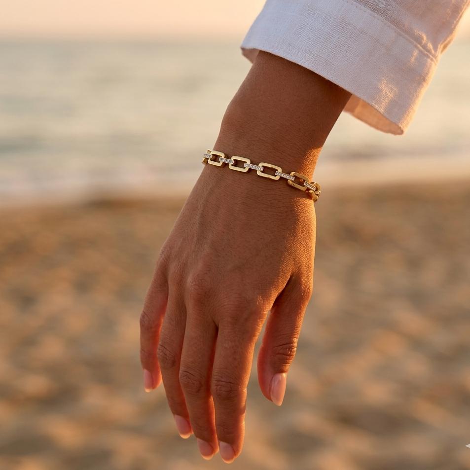 Gold-plated steel bangle bracelet – large rectangular links & brilliant rhinestones