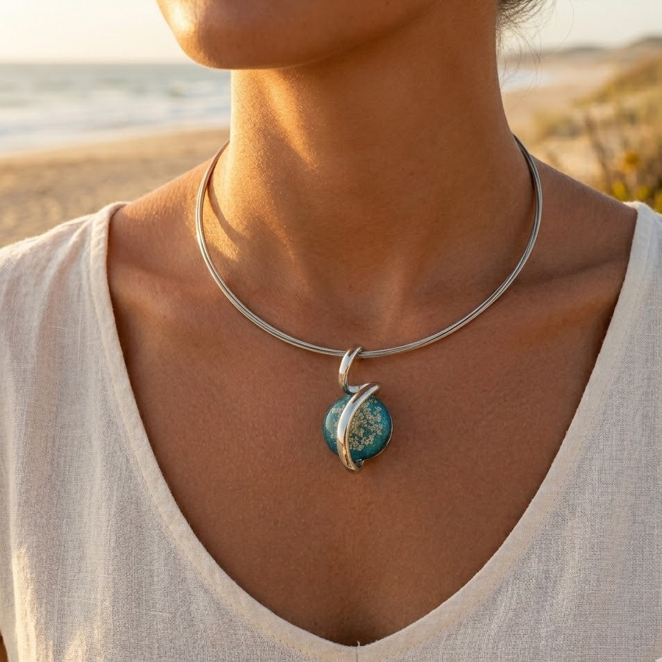 Multi-strand cable necklace with round resin pendant – dried natural flowers