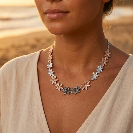 Gold and silver-tone flower necklace on an adjustable chain