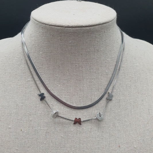 Collier double chaîne acier inoxydable doré maille miroir vénitienne papillons dorés rondelles fines strass
