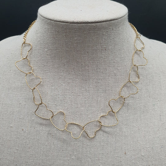 Collier acier doré chaîne fine maille forçat cœurs entrelacés métal doré