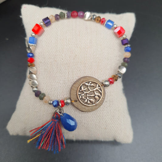 Bracelet élastique perles colorées et pompon doré