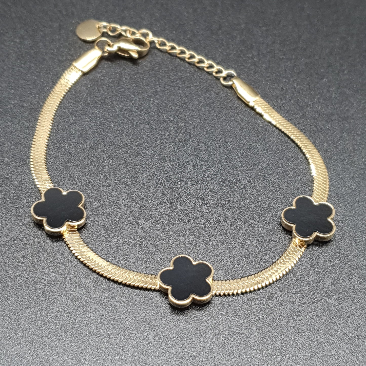 Stainless steel bracelet with gilded mirror chain and metal flowers set with mother-of-pearl