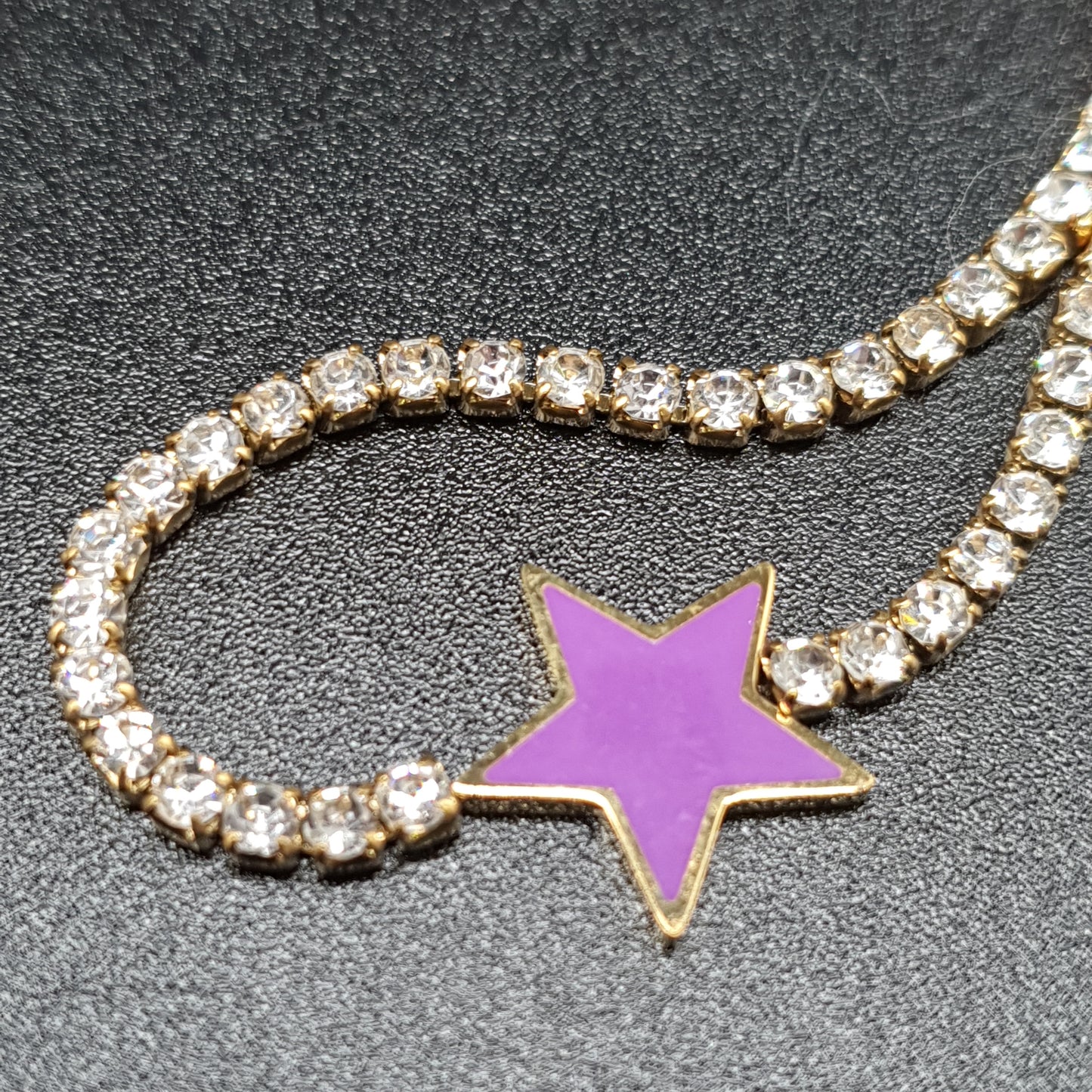 Gold stainless steel bracelet with mesh set with white rhinestones and purple enamel star pendant