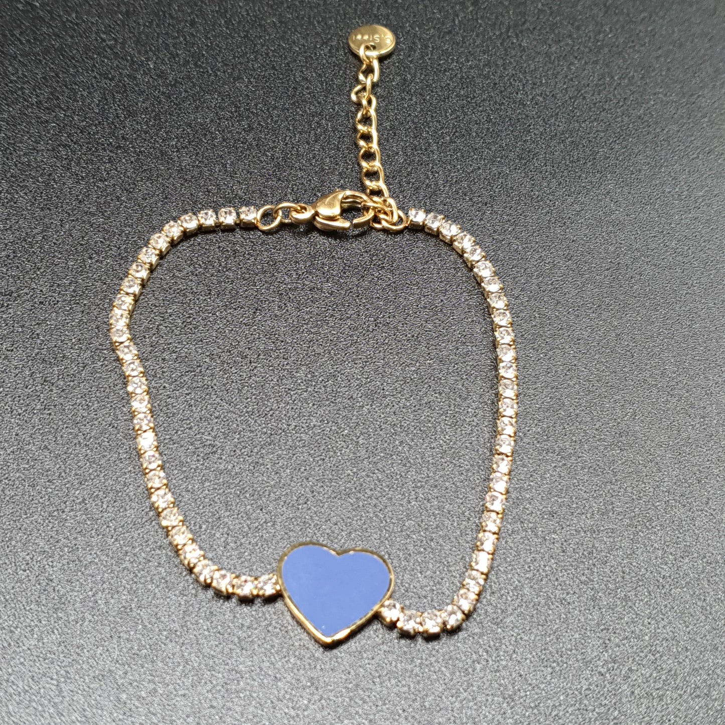Gold-plated stainless steel bracelet with mesh set with white rhinestones and a blue enamel heart pendant