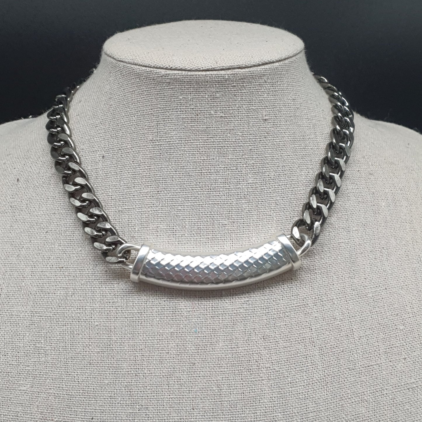 Silver plated bib necklace with a chic and bold curb chain design