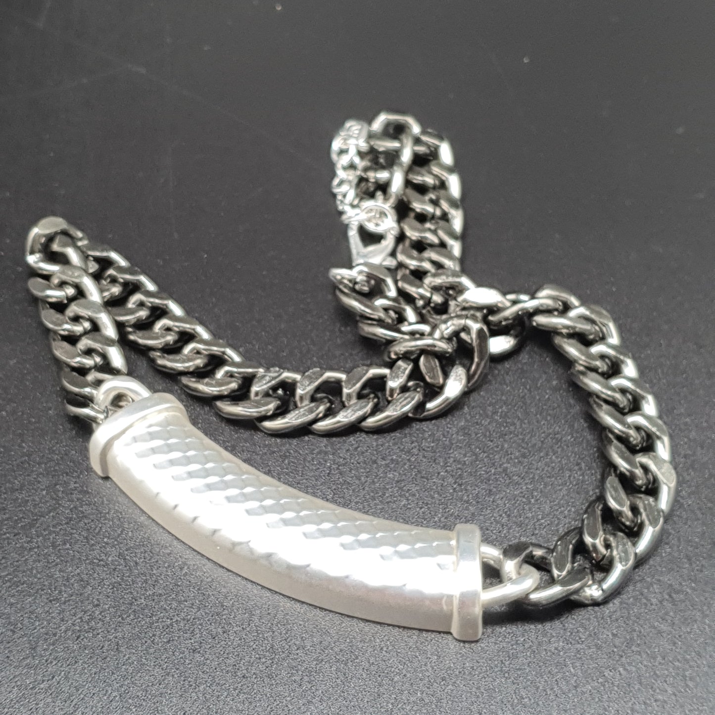 Silver plated bib necklace with a chic and bold curb chain design